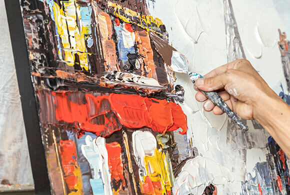 Hand-built texture up close — pigment on canvas from the studio floor